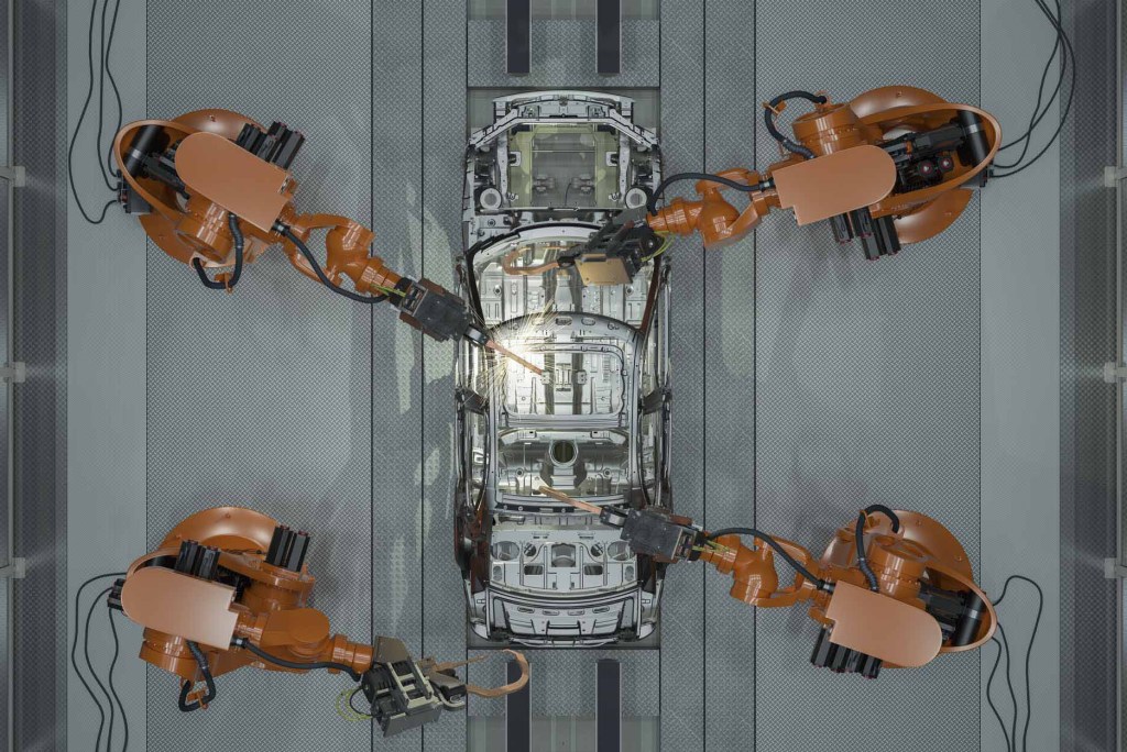Assembly Line Of Robots Welding Car Body