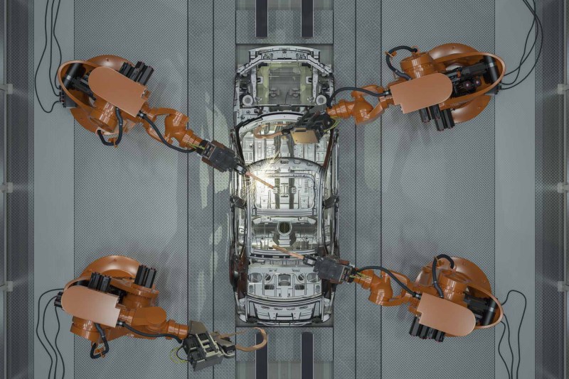 Assembly Line Of Robots Welding Car Body